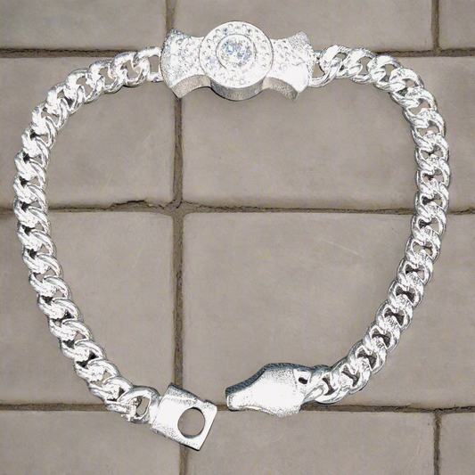 This appears to be a silver bracelet designed for kids, featuring a unique design with a circular centerpiece and a snake-like clasp. The bracelet is made of interlocking links and has a silver finish, with a weight of 10.600 grams. These ength 5.5 inch